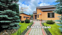 Фото жилой кирпичный 4х-комнатный коттедж 156 м2 с гаражом, баней, летней кухней и садом в дубовое